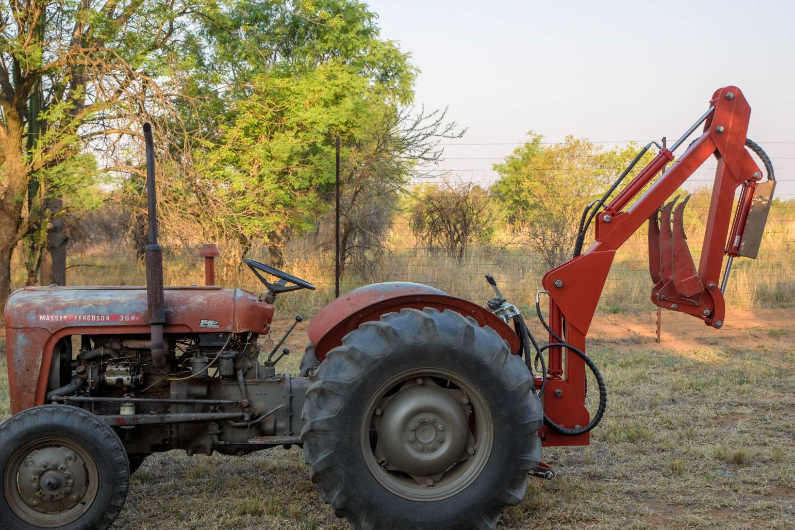 Three-point backacter type multitool for smaller tractors.