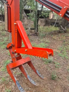 Three-point backacter type multitool for smaller tractors.