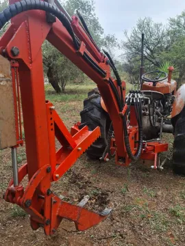 Three-point backacter type multitool for smaller tractors.