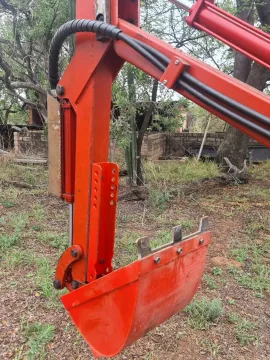 Three-point backacter type multitool for smaller tractors.
